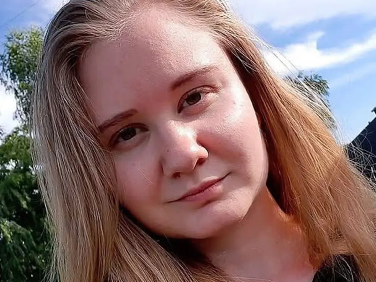 Darya Shipilova, a lab worker from Irkutsk, shown in a single portrait photograph